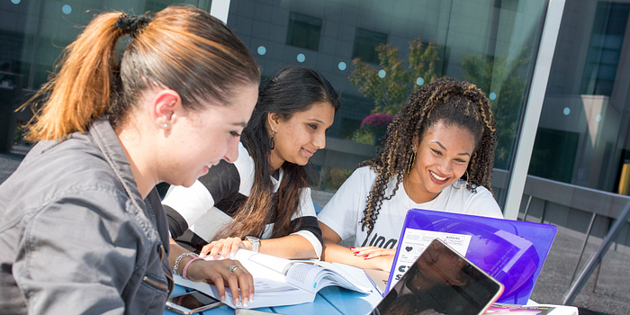 picture of centennial college students filling out the national college health assessment at progress campus
